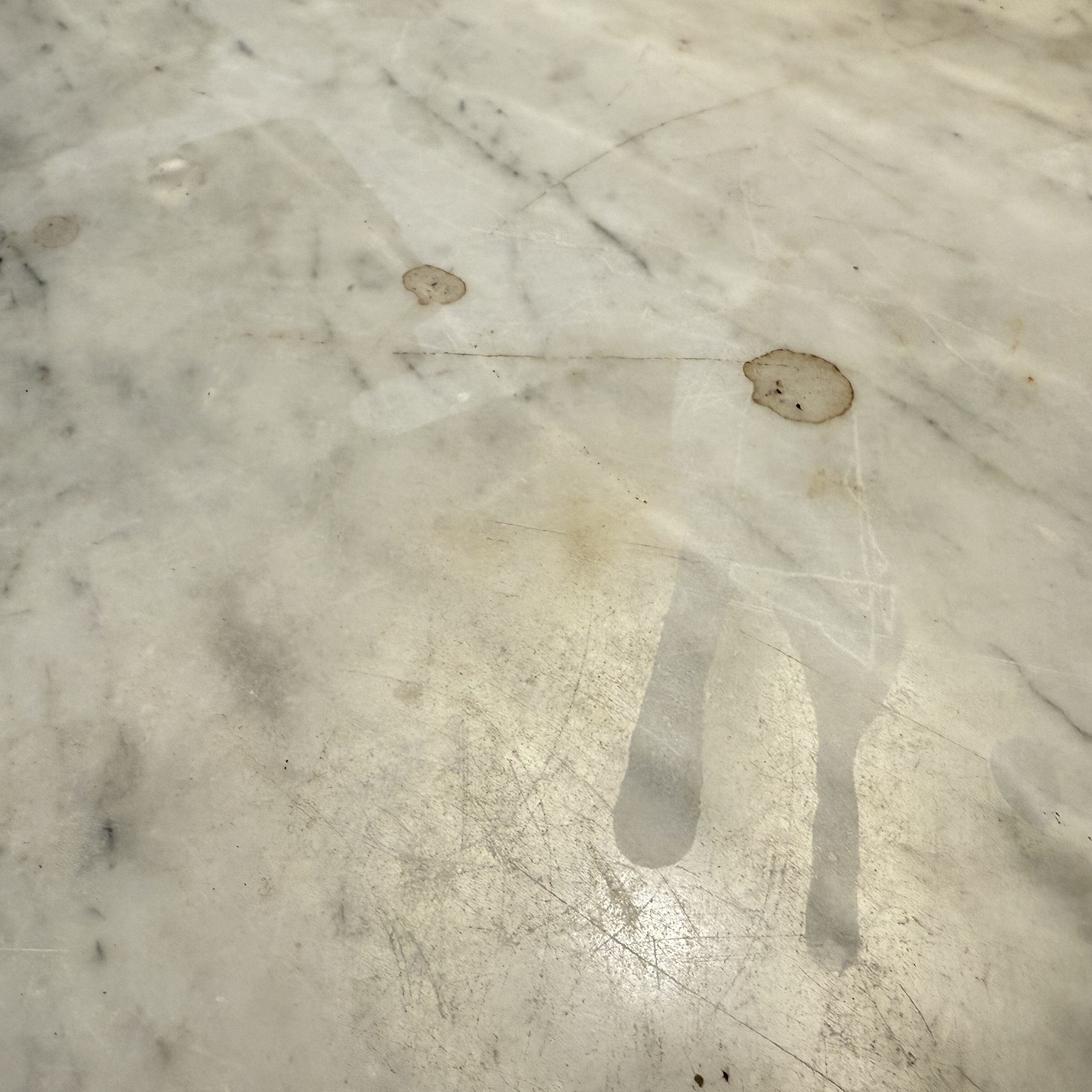 Cloudy etched marble surface before polishing