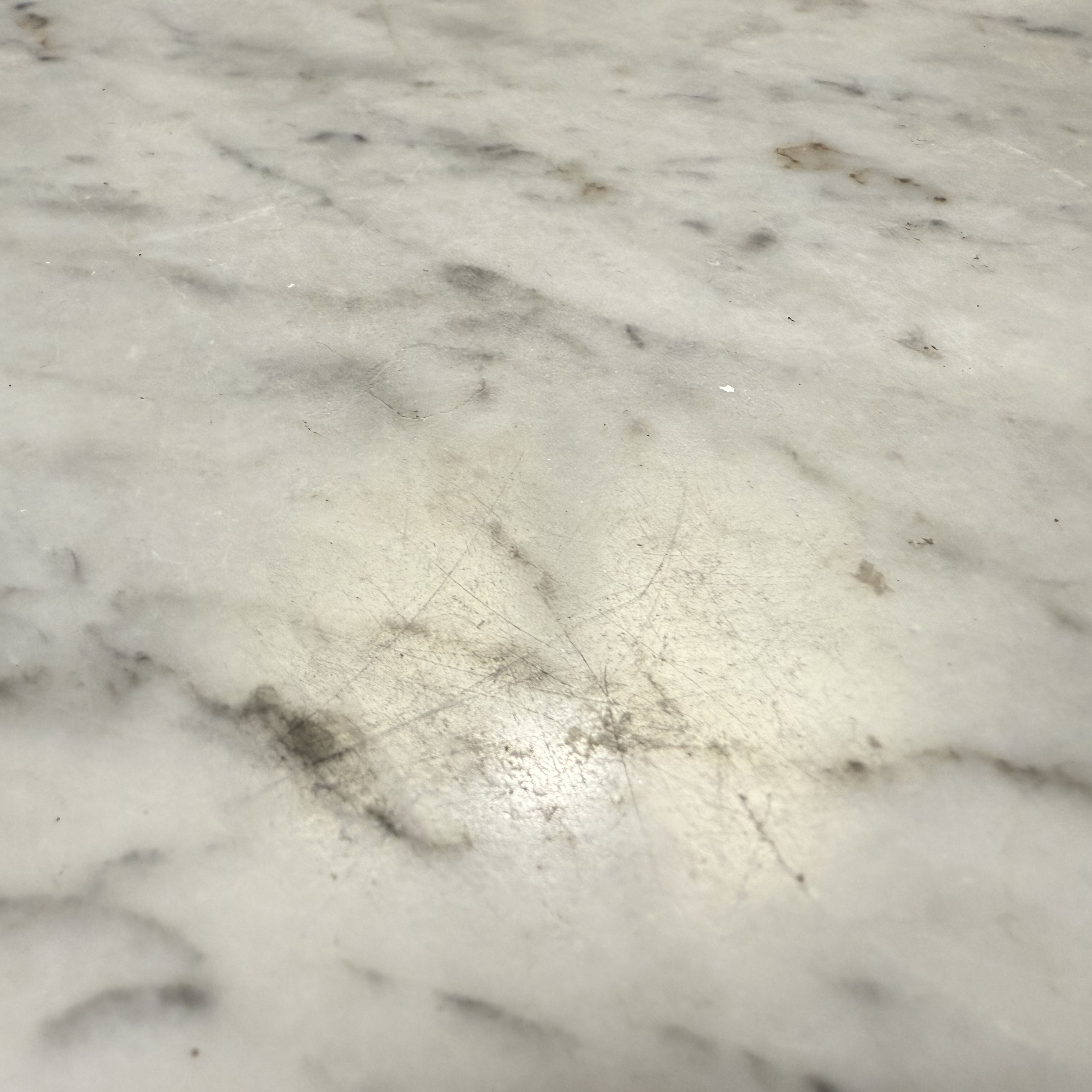 Scratched marble countertop before polishing and repair